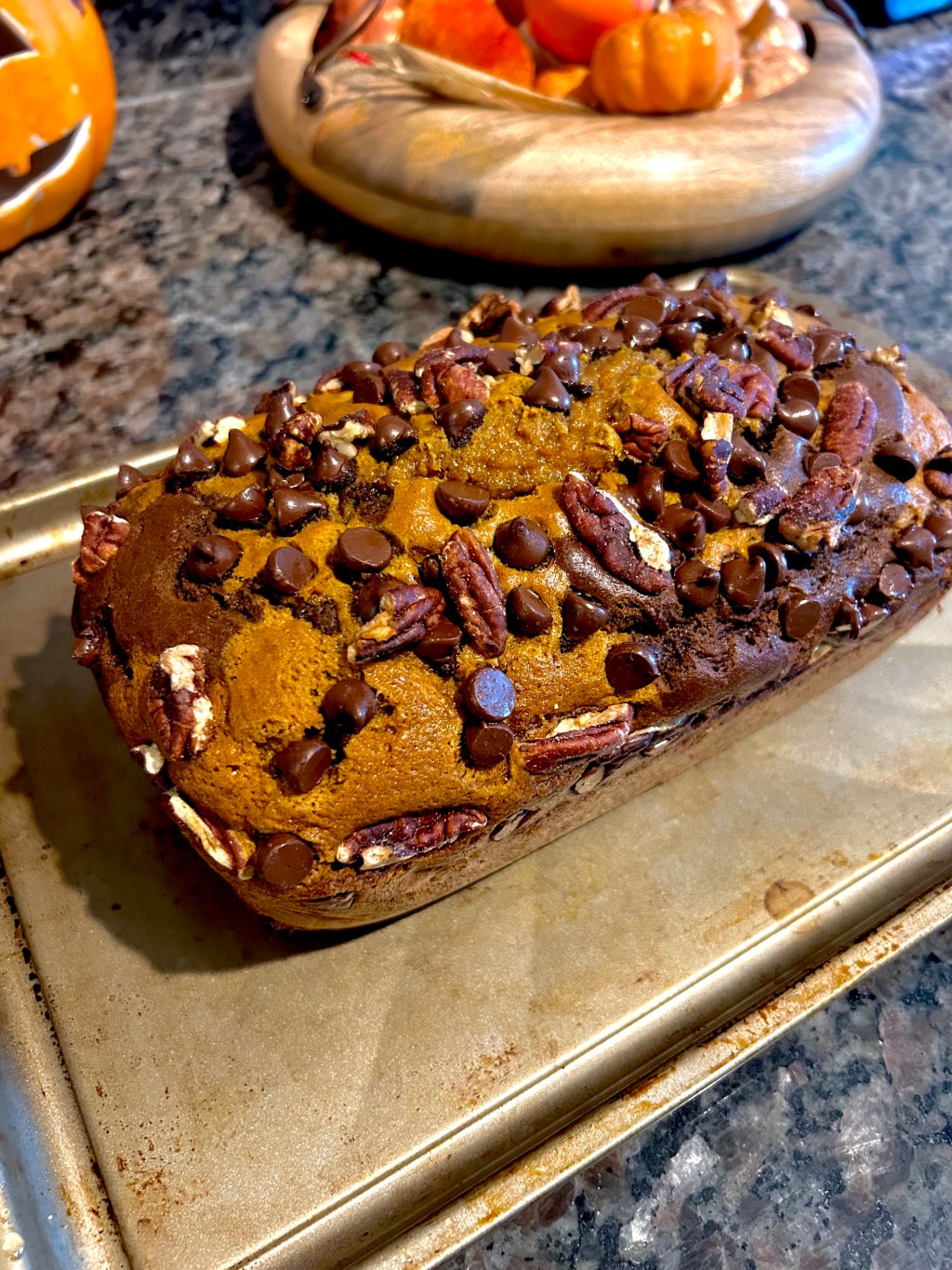 Easy pumpkin chocolate pecan loaf with a chocolate swirl, chocolate chips, and crunchy pecans. One loaf pan, no mixer required.